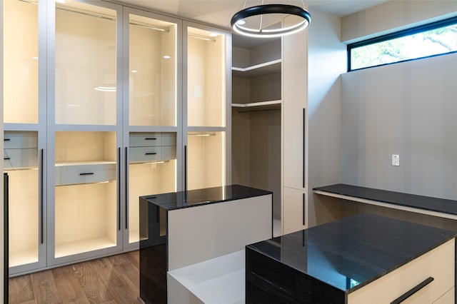 2222 Branard St, Houston, TX 77098 - walk in closet with wood finished floors