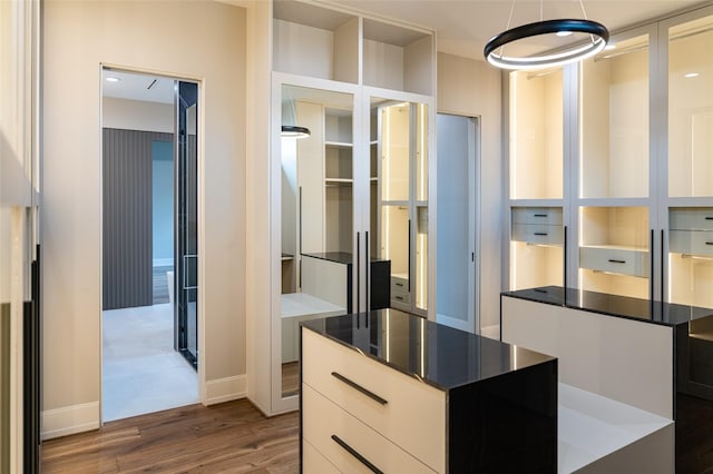 2222 Branard St, Houston, TX 77098 - spacious closet with dark wood-type flooring