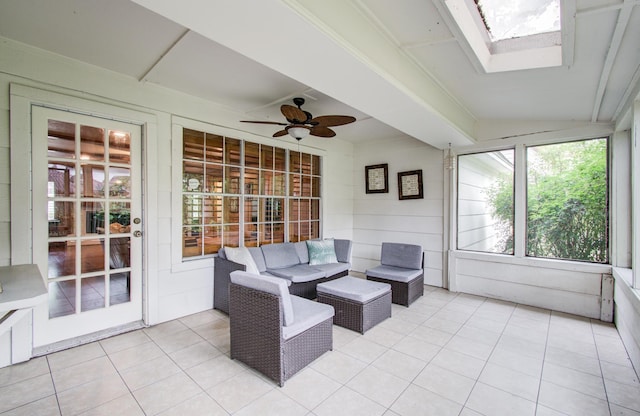 sunroom with a ceiling fan, a skylight, and outdoor lounge area