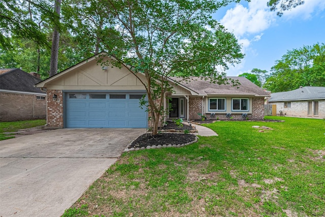 14823 Forest Lodge Dr, Houston, TX 77070 - ranch-style home with a garage, driveway, a front lawn, and brick siding