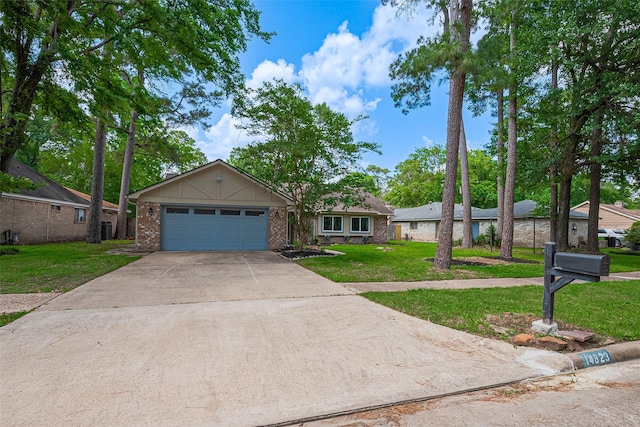 14823 Forest Lodge Dr, Houston, TX 77070 - ranch-style home with a garage, a front lawn, brick siding, board and batten siding, and driveway