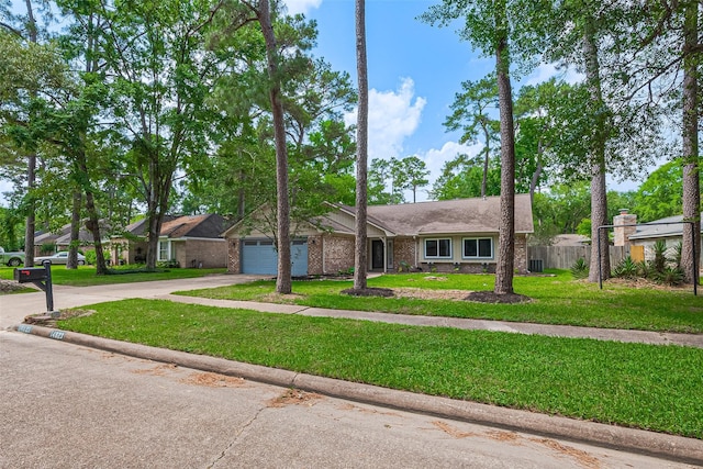 14823 Forest Lodge Dr, Houston, TX 77070 - single story home featuring fence, brick siding, a garage, a front yard, and concrete driveway