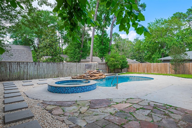 14823 Forest Lodge Dr, Houston, TX 77070 - view of swimming pool with a pool with connected hot tub, a fenced backyard, and a patio area