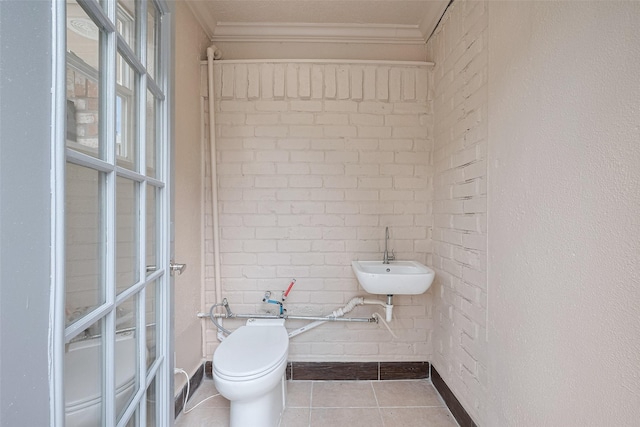 14823 Forest Lodge Dr, Houston, TX 77070 - half bath featuring crown molding, toilet, a sink, and tile patterned flooring