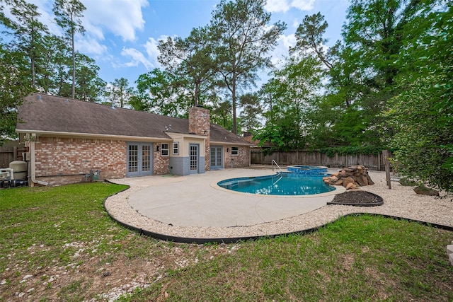 14823 Forest Lodge Dr, Houston, TX 77070 - view of pool with french doors, a patio, a yard, and a fenced backyard