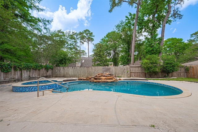 14823 Forest Lodge Dr, Houston, TX 77070 - view of pool featuring an in ground hot tub, a fenced in pool, a fenced backyard, and a patio area
