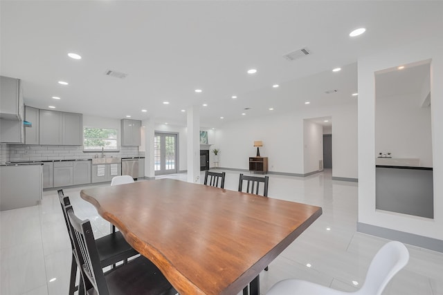 14823 Forest Lodge Dr, Houston, TX 77070 - dining room with recessed lighting, visible vents, and light tile patterned floors