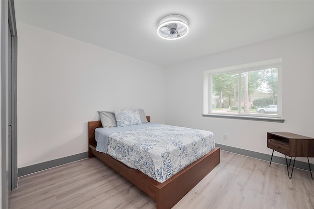 14823 Forest Lodge Dr, Houston, TX 77070 - bedroom featuring baseboards and light wood-style flooring