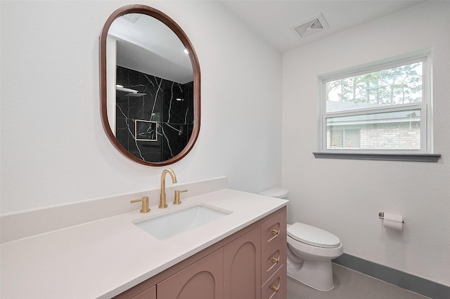 14823 Forest Lodge Dr, Houston, TX 77070 - bathroom featuring visible vents, walk in shower, vanity, baseboards, and toilet