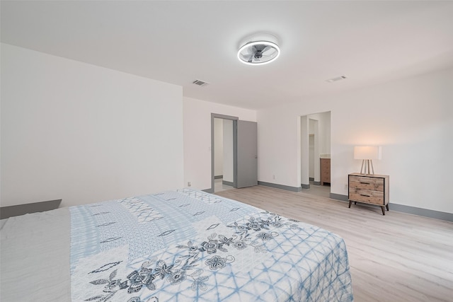 14823 Forest Lodge Dr, Houston, TX 77070 - bedroom featuring visible vents, light wood finished floors, and baseboards