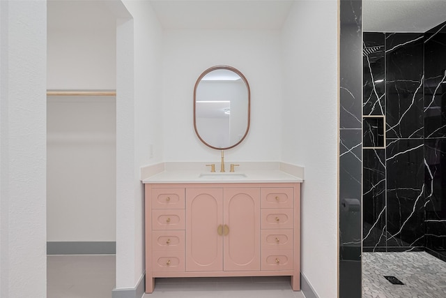 14823 Forest Lodge Dr, Houston, TX 77070 - full bath featuring a marble finish shower, baseboards, and vanity