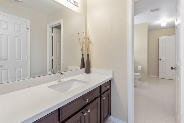 3902 Lakeridge Canyon Dr, Sugar Land, TX 77498 - bathroom with tile patterned floors, toilet, vanity, and baseboards