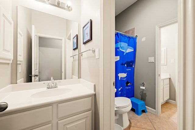 bathroom featuring toilet, a shower with curtain, tile patterned flooring, and vanity