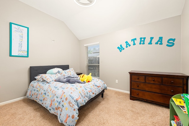 bedroom featuring baseboards, carpet, and vaulted ceiling
