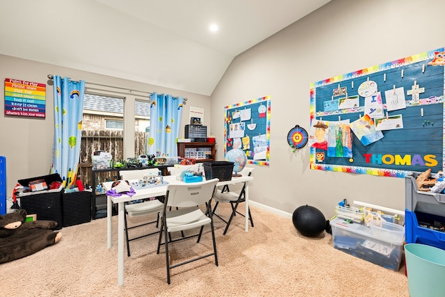 interior space with lofted ceiling, carpet, and baseboards