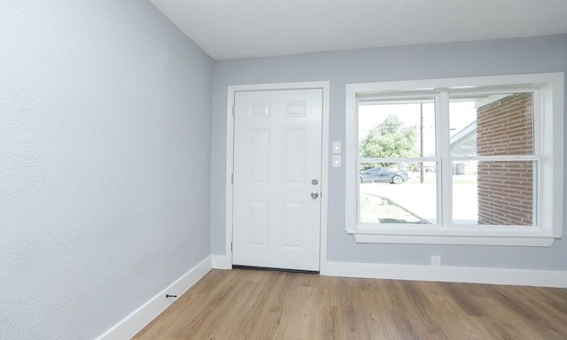 4538 Clover St, Houston, TX 77051 - doorway to outside featuring baseboards and light wood finished floors