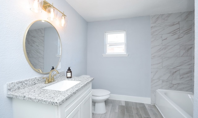 4538 Clover St, Houston, TX 77051 - bathroom featuring baseboards, wood finished floors, vanity, and toilet