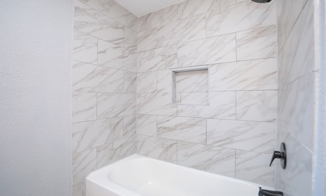 4538 Clover St, Houston, TX 77051 - bathroom with bathtub / shower combination and a textured wall