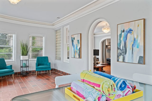 bedroom with arched walkways, visible vents, baseboards, and ornamental molding