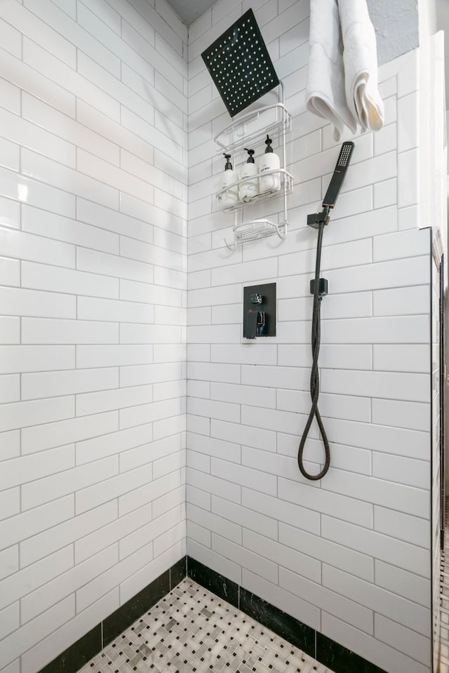 bathroom with tiled shower