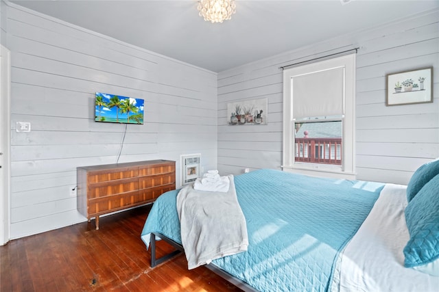 1919 Rosenberg St, Galveston, TX 77550 - bedroom with wood walls and wood-type flooring