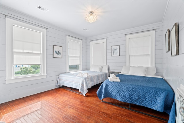 1919 Rosenberg St, Galveston, TX 77550 - bedroom featuring wood finished floors and wood walls