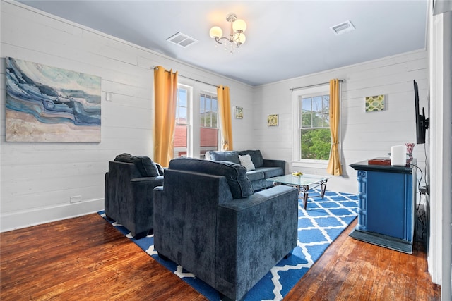 1919 Rosenberg St, Galveston, TX 77550 - living area with wood finished floors, wooden walls, and a chandelier