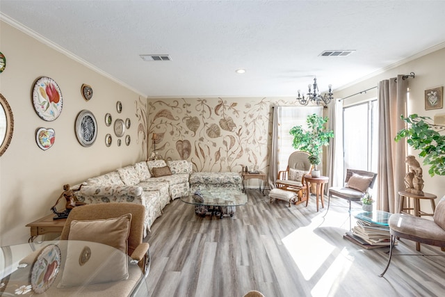 living area featuring wood finished floors, visible vents, and crown molding
