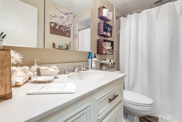 full bath featuring toilet and vanity