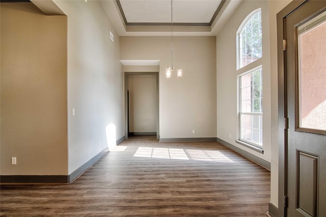 250 Bucek Ln, Schulenburg, TX 78956 - unfurnished dining area with a wealth of natural light, baseboards, and dark wood-style floors