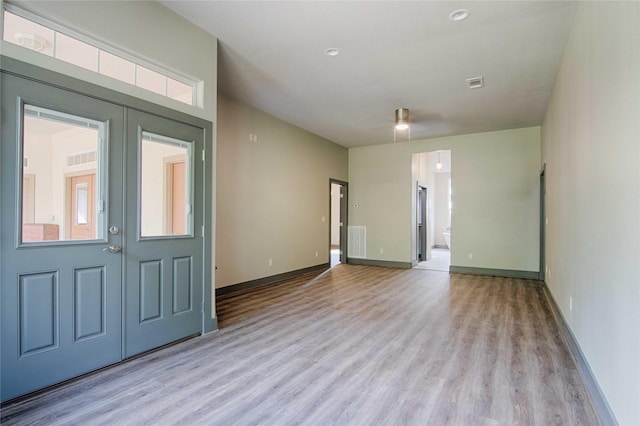 250 Bucek Ln, Schulenburg, TX 78956 - foyer entrance featuring light wood-style flooring, baseboards, and visible vents