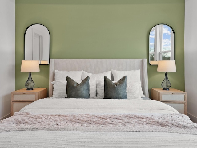 bedroom featuring baseboards