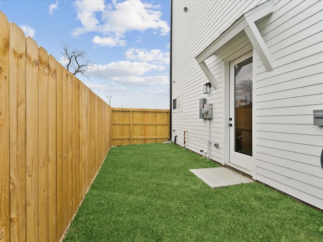 view of yard featuring a fenced backyard