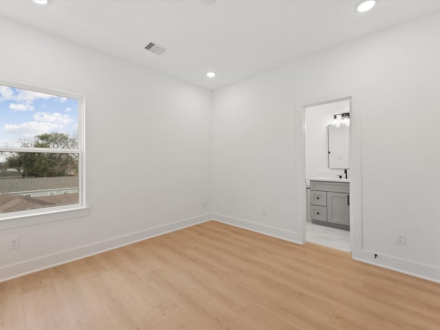 unfurnished bedroom featuring recessed lighting, light wood-style flooring, and visible vents