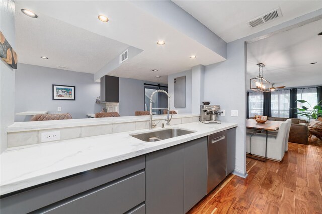 8924 Chatsworth Dr, Houston, TX 77024 - kitchen with open floor plan, gray cabinets, a sink, stainless steel dishwasher, and recessed lighting