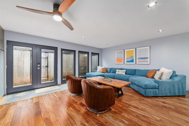 8924 Chatsworth Dr, Houston, TX 77024 - living room featuring french doors, wood finished floors, a ceiling fan, plenty of natural light, and recessed lighting