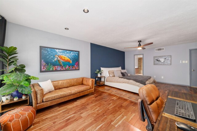 8924 Chatsworth Dr, Houston, TX 77024 - bedroom featuring light wood-type flooring and a ceiling fan