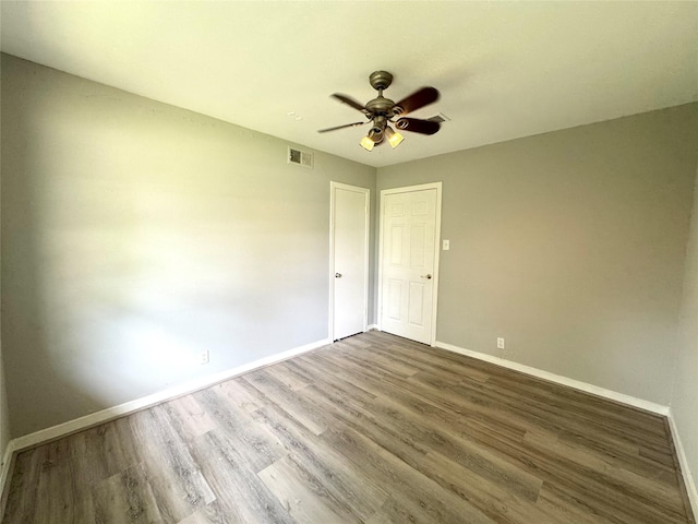 7905 Turquoise Ln, Houston, TX 77055 - unfurnished room with baseboards, a ceiling fan, and wood finished floors