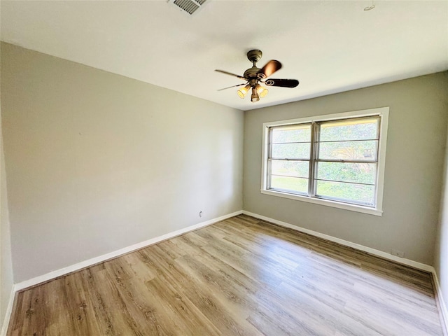 7905 Turquoise Ln, Houston, TX 77055 - spare room featuring wood finished floors, baseboards, and a ceiling fan