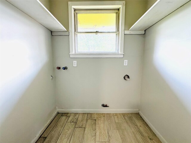 7905 Turquoise Ln, Houston, TX 77055 - laundry room featuring wood finished floors, baseboards, and hookup for a washing machine