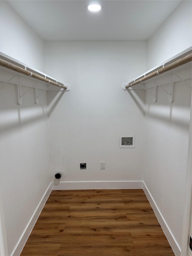 4414 Orange St, Houston, TX 77020 - clothes washing area featuring laundry area, washer hookup, baseboards, wood finished floors, and hookup for an electric dryer