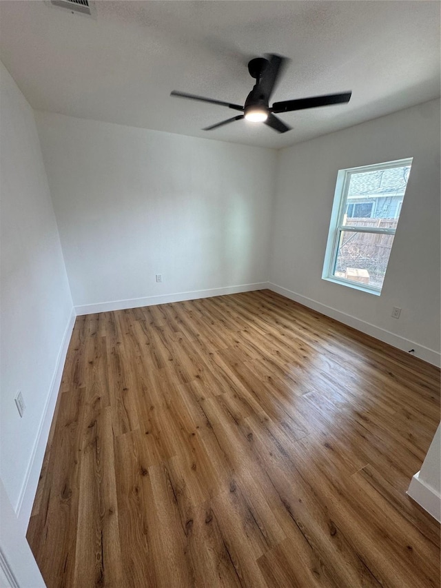 4414 Orange St, Houston, TX 77020 - spare room with a ceiling fan, baseboards, visible vents, and wood finished floors