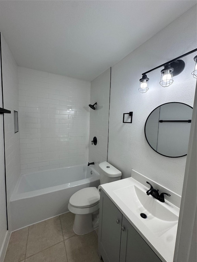 4414 Orange St, Houston, TX 77020 - full bathroom featuring tile patterned flooring, vanity, a textured wall, toilet, and  shower combination