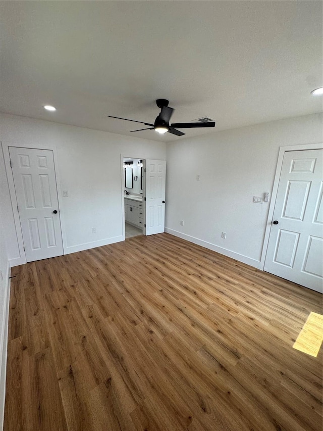 4414 Orange St, Houston, TX 77020 - unfurnished living room with baseboards, recessed lighting, ceiling fan, and wood finished floors