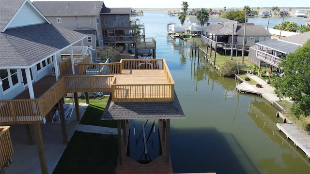 view of dock featuring a deck with water view and a residential view