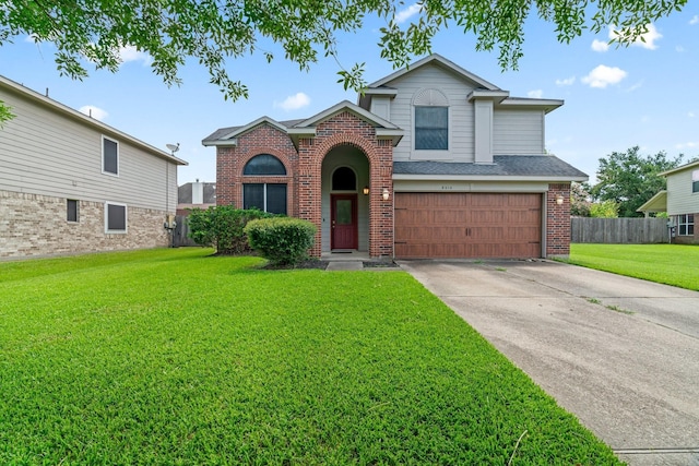 8010 Fox St, Baytown, TX 77523 - traditional home with fence, a front lawn, driveway, brick siding, and a garage
