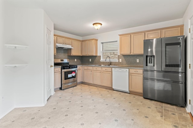 8010 Fox St, Baytown, TX 77523 - kitchen featuring stainless steel appliances, a sink, decorative backsplash, light brown cabinets, and under cabinet range hood