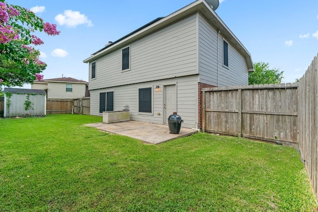 8010 Fox St, Baytown, TX 77523 - back of property featuring a patio area, a storage shed, a fenced backyard, an outdoor structure, and a yard