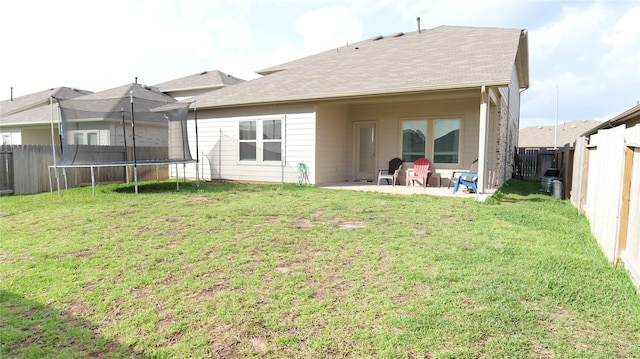 40607 Creekside Bluff Trl, Magnolia, TX 77354 - rear view of house with a trampoline, a patio, and roof with shingles