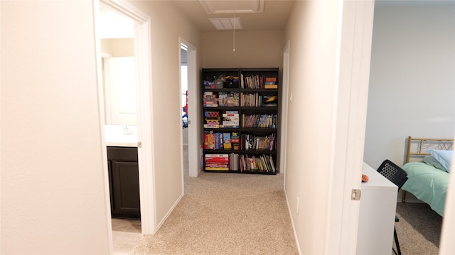 40607 Creekside Bluff Trl, Magnolia, TX 77354 - hallway with attic access and light carpet